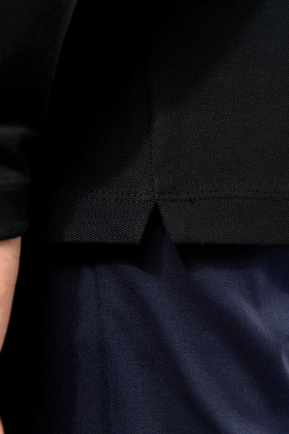 De details van de premium heren polo.